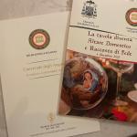 Il menu e l'opuscolo realizzato dal Vescovo per gli Accademici